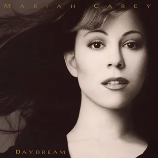 The Evolution of Mariah Carey - Mariah did it again in 1995 with Daydream, topping the charts and selling over 10 million copies in the U.S. alone. The album featured more of a hip hop/R&amp;B sound than her previous pop-oriented efforts, and included "Fantasy," which debuted at No. 1 — making Carey the first female artist to do so.(Photo: Columbia Records)