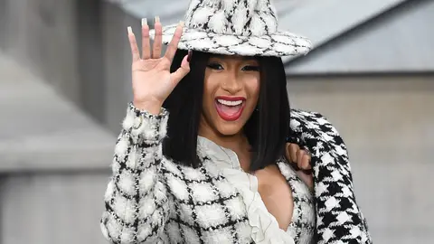 TOPSHOT - US rapper Cardi B waves as she arrives prior to the Chanel Women's Spring-Summer 2020 Ready-to-Wear collection fashion show at the Grand Palais in Paris, on October 1, 2019. (Photo by Christophe ARCHAMBAULT / AFP) (Photo by CHRISTOPHE ARCHAMBAULT/AFP via Getty Images)