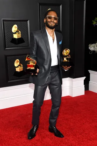 Kaytranada collected his awards in a trendy Louis Vuitton suit. - (Photo by Kevin Mazur/Getty Images for The Recording Academy )