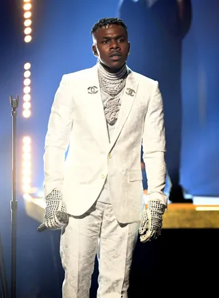 DaBaby later changed into this fly white ensemble with lots of diamond bling. - (Photo by Kevin Mazur/Getty Images for The Recording Academy)