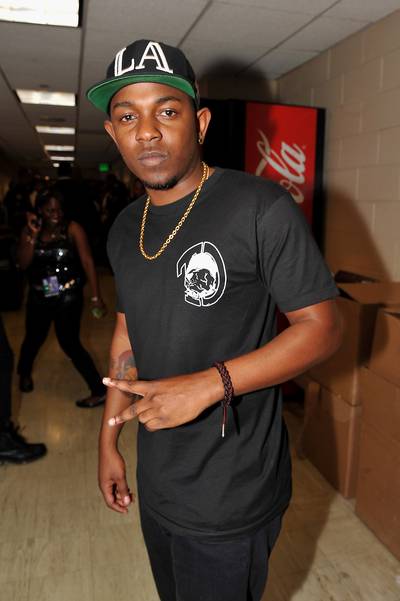 At the Same Damn Time - Who knew Kendrick Lamar was such a talented multi-tasker? He was nominated, he performed and presented. Here he's backstage throwing up the peace sign and repping for Los Angeles.(Photo: Moses Robinson/Getty Images for BET)