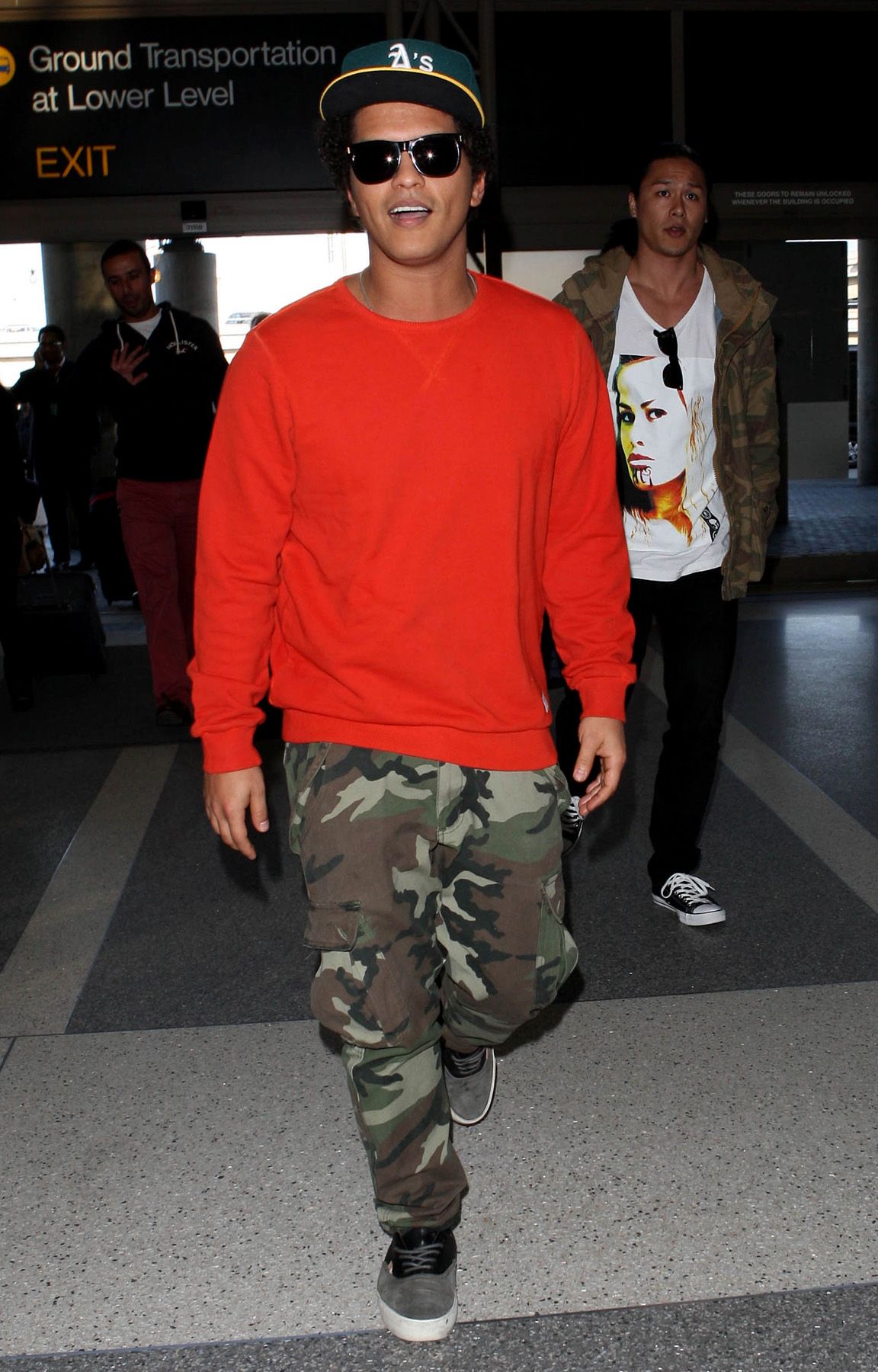 camo pants and red shirt