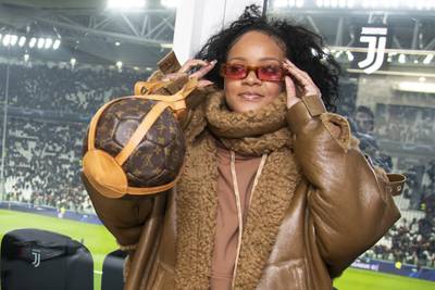 Ballin'&nbsp; - On Tuesday (Nov. 26),&nbsp;Rihanna&nbsp;attended a UEFA Champions League match in Turin, Italy wearing an oversized brown leather coat from her Fenty collection. Being the fashion maven she is, Rih paired the look with a pair of red shades and a priceless Louis Vuitton purse.(Photo:Giorgio Perottino - Juventus FC/Getty Images) (Photo: Giorgio Perottino - Juventus FC/Getty Images)
