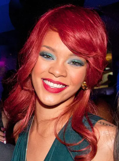 Best Hair-Rihanna - Rih Rih’s been the go-to starlet for hot hair for more than a few years now. From her signature asymmetrical bob circa “Umbrella,” her retro half-shaved ‘do to the bright red locks she wore early this year, Rihanna’s hair game stays tight. It’s no wonder that a story surfaced reporting that her stylist, Ursula Stephen, earns $22,000 per week. Sounds like money well spent. (Photo: Tom Donoghue/PictureGroup)