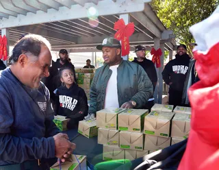 Good Deeds - DJ Mustard participates in WorldStarHipHop's 3rd Annual Skid Row Holiday Giveaway in downtown L.A.(Photo: Charley Gallay/Getty Images for WorldStarHipHop)