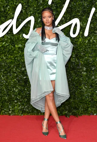 'Urban Luxe' Queen - Rihanna brought Barbados to London for the London Fashion Awards! Bad Gal RiRi accepted her 'Urban Luxe' award for her LVMH Fenty line wearing, of course, Fenty! She debuted her intricate Fulani, shoulder length braids in a custom, mint green, Fenty ensemble including a sheer high-low jacket, sheer opera gloves, a satin mini dress and satin 'Date Night' pumps ($690).(Photo: Karwai Tang/WireImage)