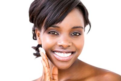 Fall Skin Care Secrets - Seasonal changes can be harsh on the skin, but don’t worry; making a few tweaks to your everyday beauty routine can help preserve healthy-looking, glowing skin. Read on to discover a few tips to help you take good care of the skin you’re in as you transition from summer to fall.  By Dontaira Terrell   (Photo: Wavebreak Media Ltd./Corbis)