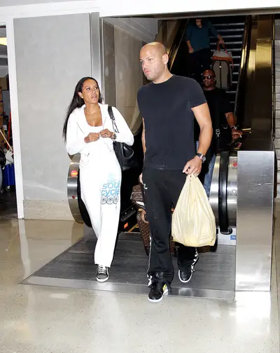 On the Go - Mel B and her husband, Stephen Belafonte, arrive at LAX in Los Angeles. (Photo: Splash News)