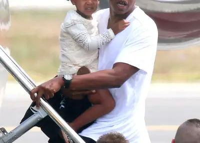 Fly Away With Me - Jay-Z and daughter Blue Ivy catch a flight out of Nice, France, after the family enjoyed a sun-filled vacation aboard a yacht in South France. &nbsp;(Photo: FameFlynet, Inc)