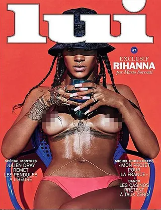 #NSFW - Rihanna wowed in this denim Kenzo bucket hat and little else on the cover of French men’s magazine&nbsp;Lui. A body chain and pink bikini bottoms round out the risqué look.   (Photo: Lui Magazine, May 2014)