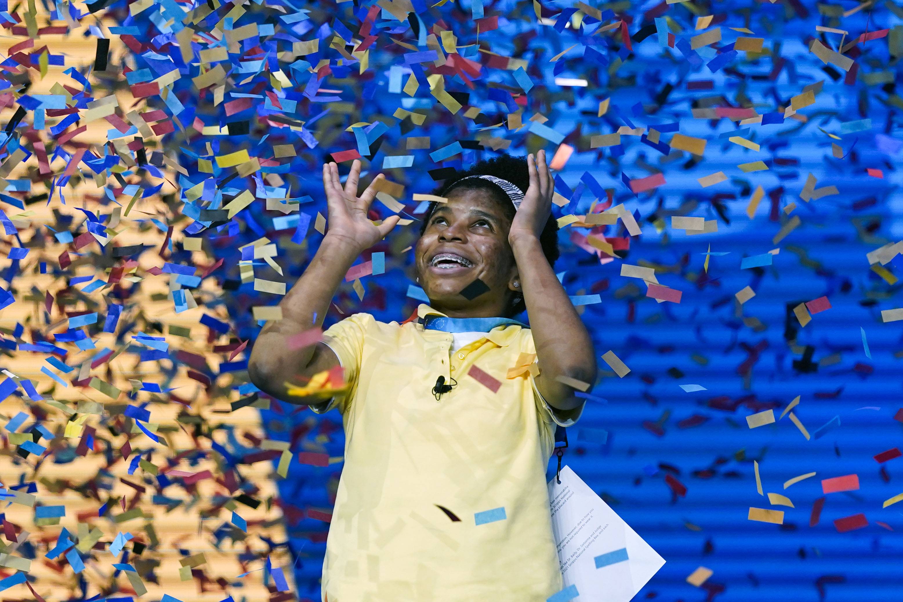 Zaila Avant-garde, 14, from Harvey, Louisiana is covered with confetti as she celebrates winning the finals of the 2021 Scripps National Spelling Bee at Disney World Thursday, July 8, 2021, in Lake Buena Vista, Fla. (AP Photo/John Raoux)