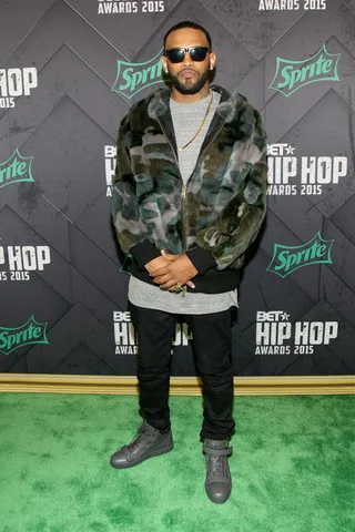 New School  - Rapper Joyner Lucas joins the carpet with a casual hip hop look, from the camoflauge hoodie to his greyed out kicks. (Photo: Bennett Raglin/BET/Getty Images for BET Networks)