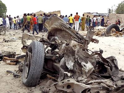 51 Dead in Blasts at Nigerian Market - Two explosions killed 51 people on Saturday night in Maiduguri, Nigeria, at a market. There was blood everywhere as people carried dead bodies and others who were injured ran from smoking buildings. Witnesses say the explosion came from a pickup truck.&nbsp;(Photo: Haruna Umar/AP Photo)
