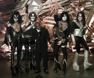 Presenting Kiss - In 1996, Tupac pushed the envelope again by presenting an award with reunited rock band Kiss on the Grammy stage. It was the first time Kiss had truly come together in 15 years. The crowd was shocked as it was only something Tupac could do. (Photo: Eric Draper/FILE/AP Photo)&nbsp;