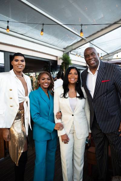 EJ, Elisa, Cookie, and Magic Johnson - Elisa Johnson celebrated the launch of her sunglasses line yesterday in LA, and her beautiful family was there to their support. Elisa wowed us in a teal blue suit while her brother EJ stunned in a white top and blazer with a gold skirt. Mom and dad were also dressed to impress. They are one stylish bunch! (Photo: Roxy Rodriguez)