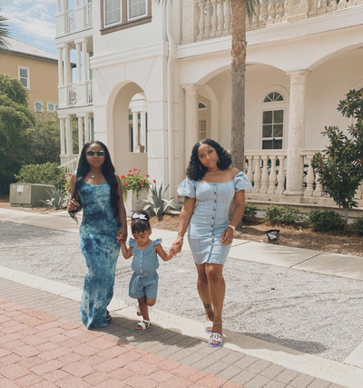 Bluesss - Reginae Carter posed in a photo with her mom Toya and little sister Reign. They all looked gorgeous in differnt shades of blue, but Reginae wowed us in this $40 tie-dye maxi dress from Fashion Nova.&nbsp; Reginae Carter