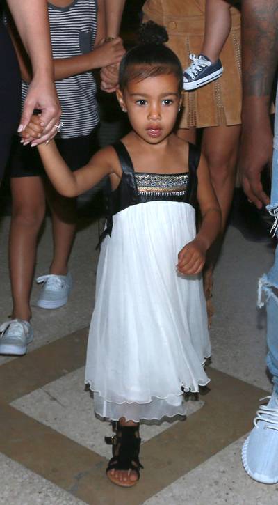Nori's Night Out - Tots do dinner parties, too — or at least this tot does! For a night out in Cuba with the fam, North donned an age-appropriate evening dress.(Photo: Brian Prahl / Splash News)