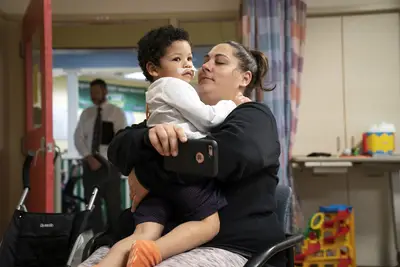 A mother comforts her child at his doctor's appointment. - (Photo: Nathan Bolster/BET)