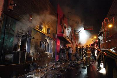 Three Arrested for Brazil Club Fire - Brazilian police made three arrests and are seeking a fourth person in connection with a deadly fire that engulfed a nightclub in southern Brazil over the weekend, leaving more than 230 people dead and nearly 80 hospitalized from injuries.&nbsp; (Photo: AP Photo/Agencia RBS)