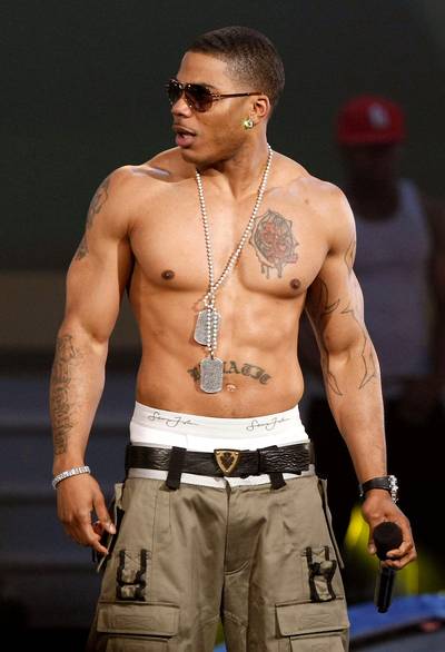 &quot;Body Marked Up Like a Subway in Harlem&quot; - How many tatts do you think Nelly has? According to sources, the mogul has five, but don't just believe us...look for yourself!   (Photo: Kevin Winter/Getty Images)