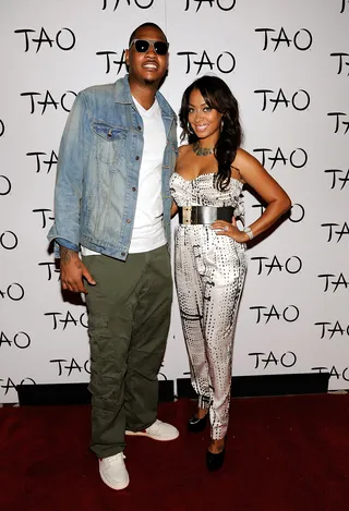 Carmelo and La La Anthony   - A belted romper like La La Anthony's is a great option when you need more mobility than a mini dress can offer but you don't want to sacrifice style. Her gold accessories keep glamour at the forefront of the look.  (Photo: David Becker/WireImage)