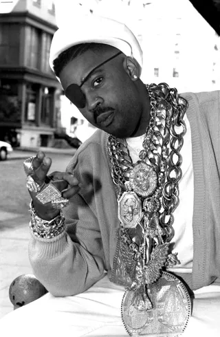 More Gold - Similar to grills, gaudy rope chains like these worn by Slick Rick, were a trend lifted directly from the local drug kingpins of the time. In fact, in the booklet for Eric B and Rakim's classic debut album, Paid in Full (released in 1987), Supreme Magnetic and the original 50 Cent, two of the most infamous NYC kingpins of that era, can be seen rocking rope chains alongside Eric B and Rakim. (Photo: Al Pereira/Michael Ochs Archives/Getty Images)