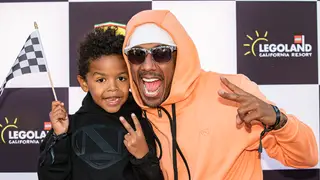 Nick Cannon (R) and Golden Cannon pose for photos at LEGOLAND California on May 11, 2022 in Carlsbad, California.