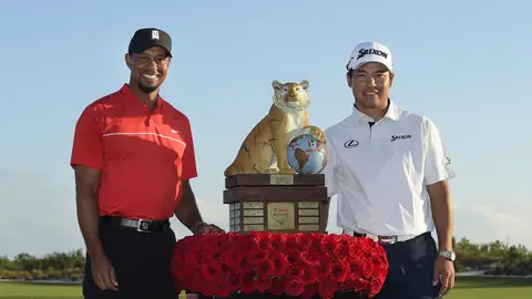 NASSAU, BAHAMAS - DECEMBER 04: (L-R) Tournament host Tiger Woods and Hideki Matsuyama of Japan poses with the winner's trophy during the Hero World Challenge at Albany course on December 4, 2016 in Nassau, Bahamas. (Photo by Stan Badz/PGA TOUR)