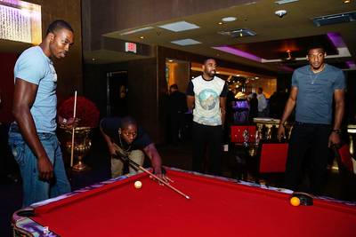 Ballers' Night Out - NBA players Dwight Howard and Robert Covington play a game of pool at Chandler Parsons' 25th birthday presented by Buffalo David Bitton at Mr. Peeples in Houston, Texas. (Photo: Rick Kern/Getty Images for Iconix Brand)