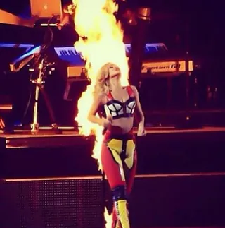 Girl on Fire - Rihanna literally sets the stage a blaze in a color block Adam Selman bustier and matching pants.  (Photo: Rihanna via Instagram)