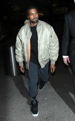 Yeezy - Kanye West arrived at Los Angeles International (LAX) Airport in his signature style and pout.&nbsp;(Photo: WENN.com)