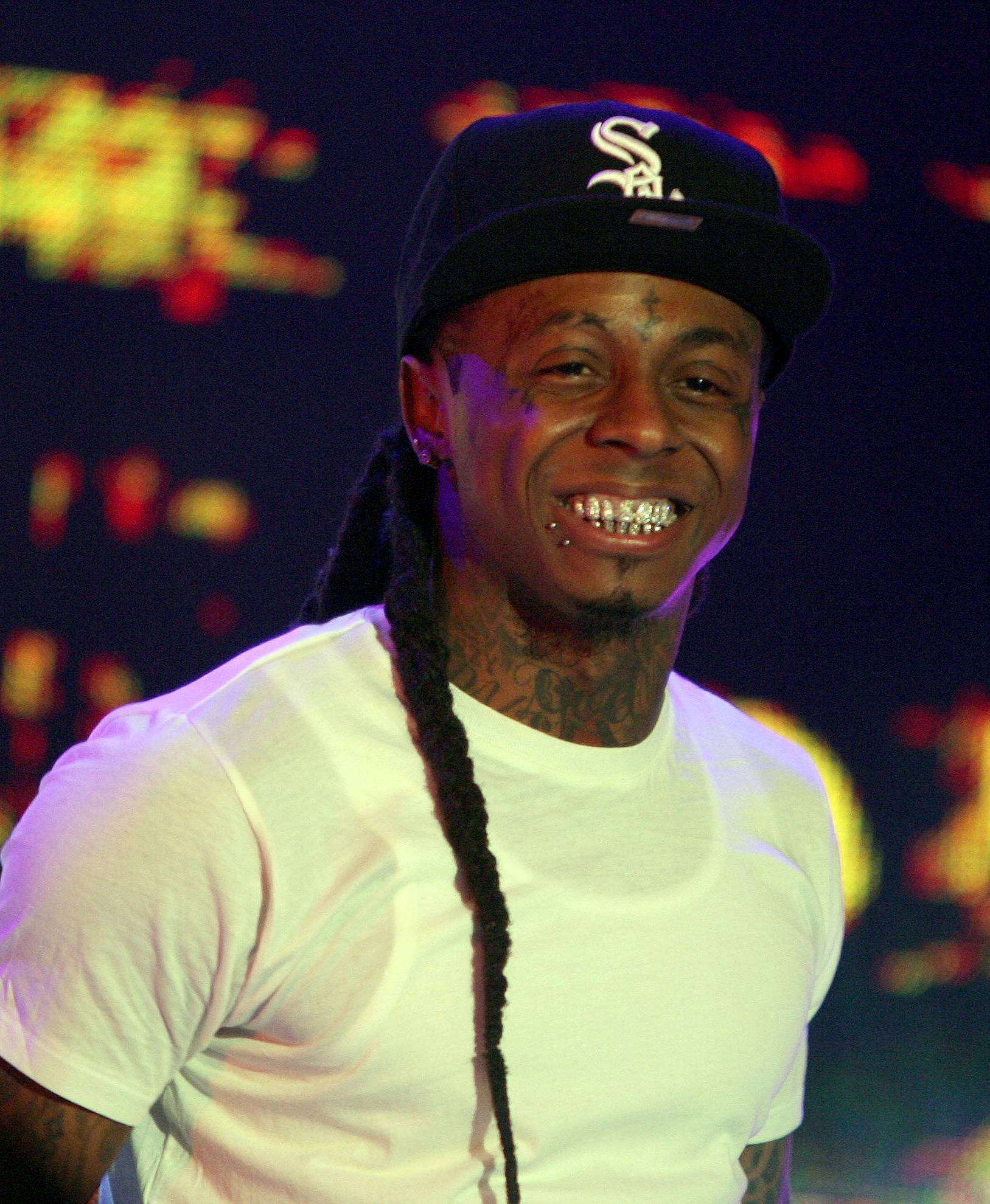 Lil’ Wayne to fans outside his home&nbsp; - &quot;Do me a favor, get the f*ck from out this neighborhood or get your head knocked the f*ck off, do that…”(Photo: PNP/WENN.com)