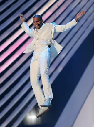2011 MTV Video Music Awards - A year after Breezy literally embodied MJ at the BET Awards, he put on another killer performance at the 2011 MTV Music Video Awards. Brown kept the crowd fully entertained with a Cirque Du Soleil&nbsp;inspired performance,&nbsp;featuring high-flying table jumping and impeccable choreography. He danced to a medley of hits including hits from Wu-Tang Clan, Nirvana and his own songs "Yeah 3X" and "Beautiful People." &nbsp;&nbsp;(Photo: Kevin Winter/Getty Images)
