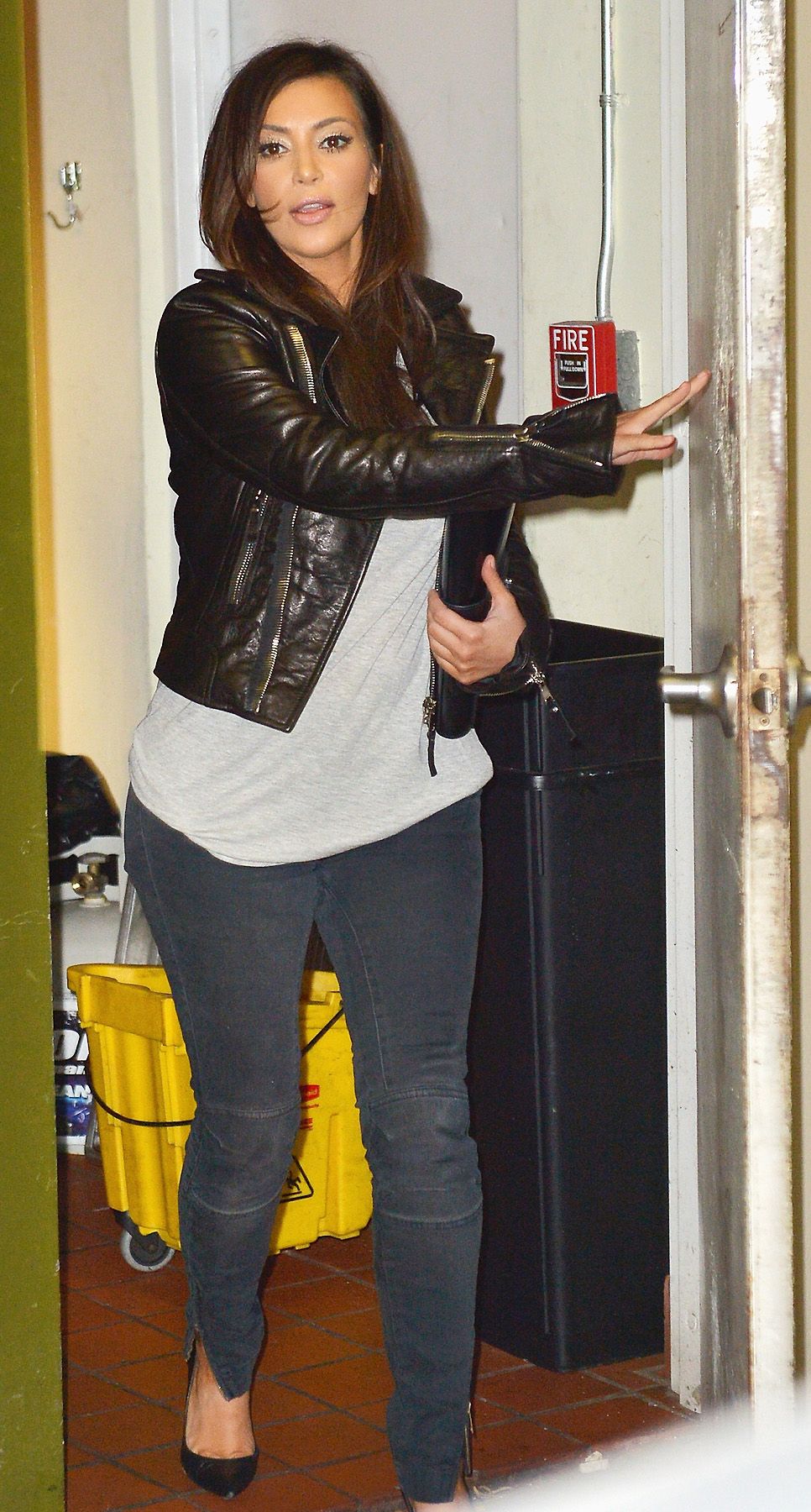 Denim Day - While Kim looked svelte and didn?t appear to have much of a baby belly just yet (Dec. 14), the buxom beauty kept things comfy in a slouchy tee and skinny jeans.  (Photo: Olivia Salazar/FilmMagic)