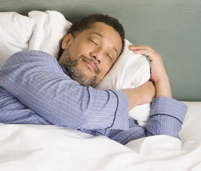 Catching Some ZZZs - In a national sleep survey released Dec. 26, 78 percent of people said they wear pajamas to bed and 74 percent admit to sleeping on their side. Forty-seven percent admitted to sharing a bed with someone who snores. (Photo: Getty Images/STOCK)