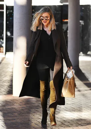 Khloe Kardashian - Dashing through LA in perfect fall attire is our favorite Kardashian&nbsp;in killer thigh-high boots.(Photo:&nbsp;INTERSTAR/Splash News/Corbis)