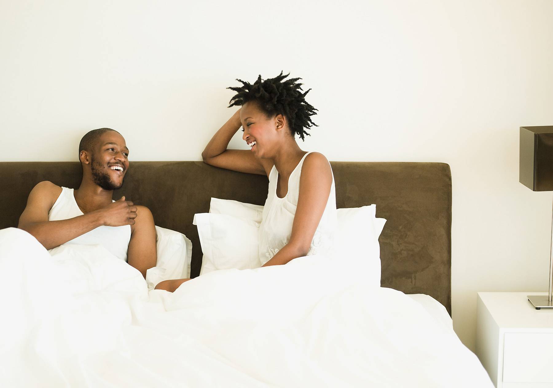 couple in bed, talking