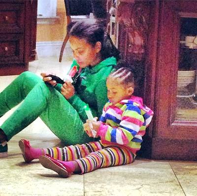 Christina Milian @christinamilian - Christina Milian&nbsp;has been juggling time in the studio and being a mommy to daughter Violet with grace this past year. Here she caught an endearing moment of the&nbsp;two enjoying popsicles on the ground while mama Milian searches for some fun activities on her phone.(Photo: Christina Milian via Instagram)