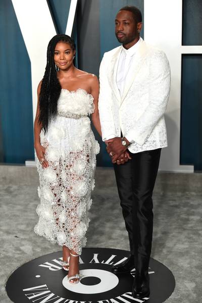 Gabrielle Union and Dwyane Wade - Gabrielle Union and Dwyane Wade win best-dressed couple at the 2020 Vanity Fair Oscar Party. Gab looks gorg in a white eyelet Giambattista Valli&nbsp;dress with box-braids. D-Wade is sharp in a traditional white and black tuxedo. (Photo by Karwai Tang/Getty Images)&nbsp; (Photo by Karwai Tang/Getty Images)