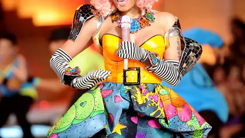 She Gets Crazy - Nicki performed “Super Bass” wearing a yellow belted corset with heart and space print tights and matching train. Would you expect anything less?(Photo: Jamie McCarthy/Getty Images)