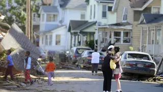 Providing Succor - The morning after the tornado residents comfort each other in Springfield.(Photo: AP Photo/Jessica Hill)