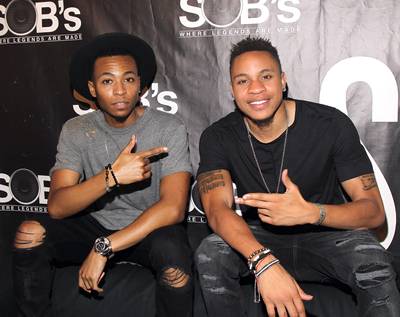 All Smiles&nbsp; - Music forms bonds with people in the audience, but it also created a brotherhood with our performers Kevin Ross and Rotimi.&nbsp;(Photo: Bennett Raglin/Getty Images)