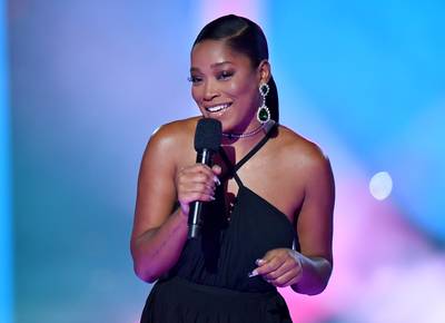 Keke Palmer&nbsp; - Keke slayed the VMAs in this Versace gown and a ponytail that reached her knees. We are loving her sleek look! (Photo: Getty)