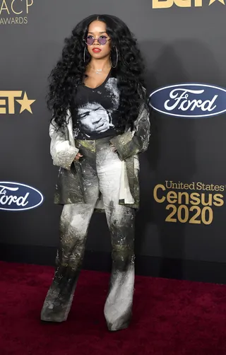 H.E.R. rocked a Jimi Hendrix graphic tee with an eye-catching Acne Studios suit. - (Photo by Frazer Harrison/Getty Images)