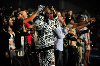Performance Perfection - Keeping fashion present in his performance, 2 Chainz rocked this outfit on stage before removing it, revealing a white T-shirt, black jeans and dope white sneakers.&nbsp;  (Photo: Moses Robinson/BET/Getty Images for BET)
