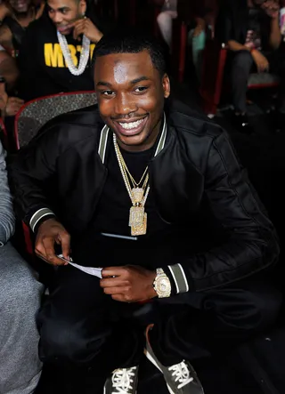 Smile - In a truly candid moment, Meek Mill got caught having a good time with a full smile on, shining brighter than the diamonds around his neck.  (Photo: Moses Robinson/BET/Getty Images for BET)