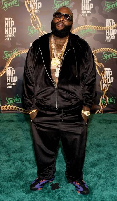 Rick Ross&nbsp; - Maybach Music's head honcho, Rick Ross, proves that fashion does, indeed, repeat itself. The Mastermind hit-maker showed up in an all-black suit, gold chain and his signature black shades.&nbsp;&nbsp;(Photo: Bennett Raglin/BET/Getty Images for BET)