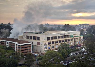 Kenyan Soldiers Busted Looting Westgate Mall - In video footage exposed by Kenyan CCTV, security cameras revealed Kenyan soldiers who responded to the Westgate Mall attack last month filling shopping bags with goods from the vacant stores in the mall. In one shot, soldiers are walking over blood-spattered floors at Nakumatt supermarket.&nbsp;(Photo: Ben Curtis/AP Photo)