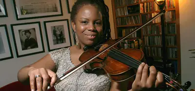 Regina Carter - Master of improvisational jazz violin, Regina Carter became a fellow in 2006. She was applauded for crafting her own unique sound style, which includes influences of Motown, Afro-Cuban, swing, bebop, folk and international music.(Photo: Courtesy of the John D. &amp; Catherine T. MacArthur Foundation)