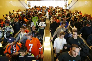 Pre-Game Scare - Emergency medical workers pushed their way through the crowd to treat several people who collapsed at a packed New Jersey train station on the way to the game.(Photo: AP Photo/Matt Rourke)